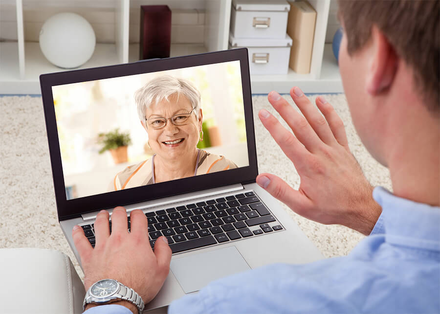 man video chatting with his elderly mother